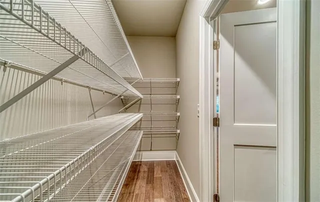 a kitchen with granite countertop a sink and a stove