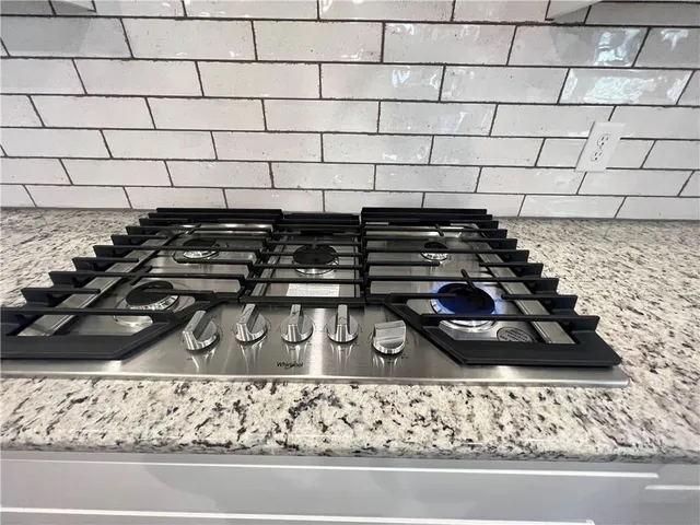 a room with a sink and cabinets