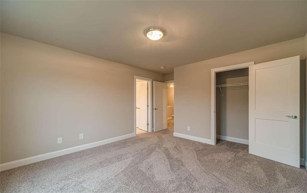 514 Adventure Trail Jefferson, GA 30549 - Photo 28 of 49 an empty room with closet and windows