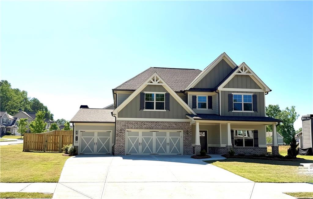 514 Adventure Trail Jefferson, GA 30549 - Photo 3 of 49 a front view of a house with a yard