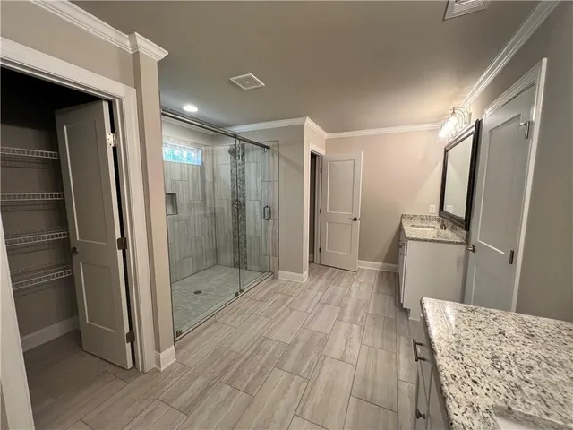 a bathroom with a tub and a shower