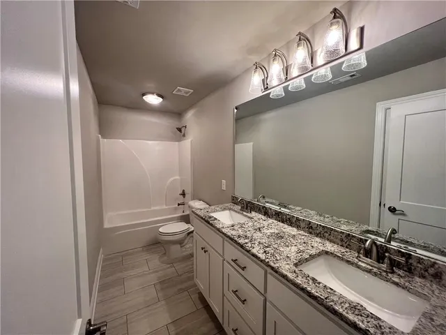 a view of a swimming pool with a yard