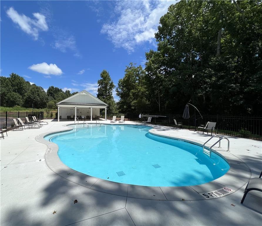 514 Adventure Trail Jefferson, GA 30549 - Photo 43 of 49 a view of a swimming pool with a yard