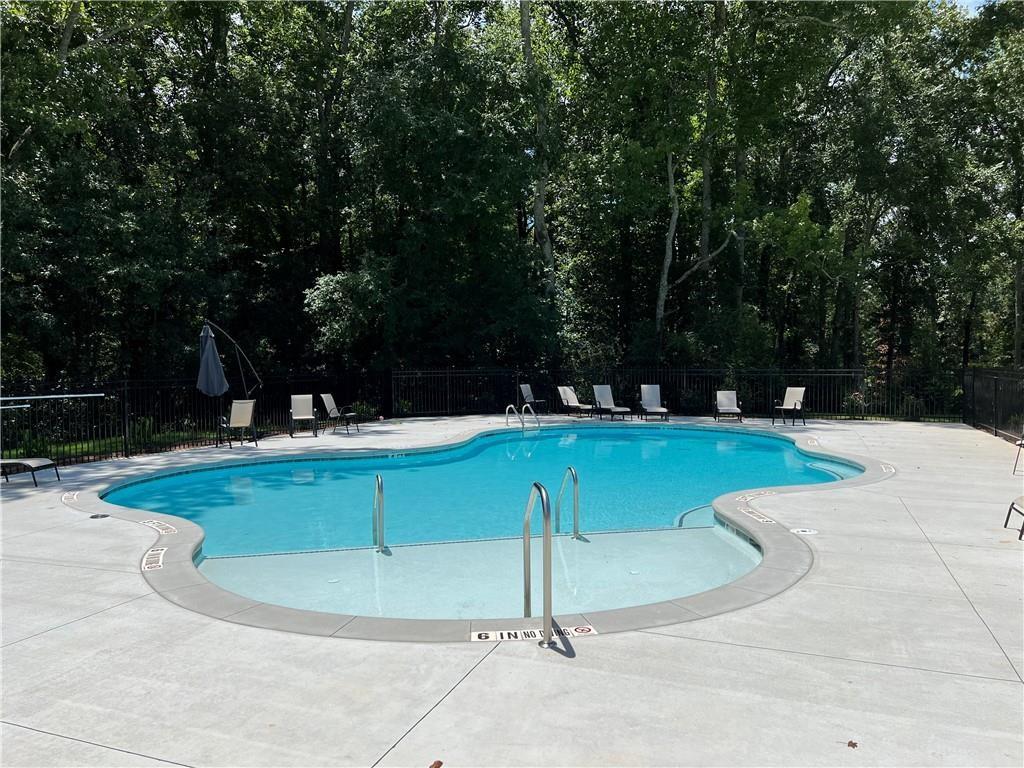 514 Adventure Trail Jefferson, GA 30549 - Photo 44 of 49 a view of a swimming pool with a yard