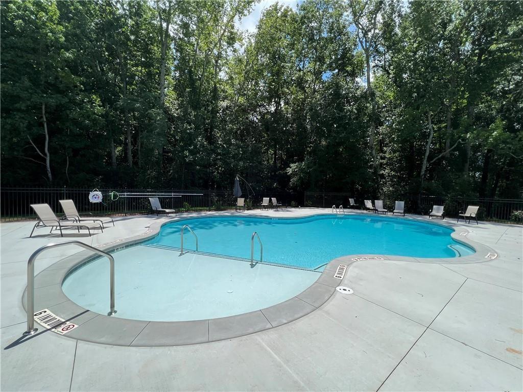 514 Adventure Trail Jefferson, GA 30549 - Photo 45 of 48 a view of a swimming pool with a yard