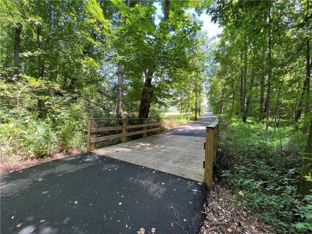 514 Adventure Trail Jefferson, GA 30549 - Photo 48 of 49 a view of a street with trees and bushes