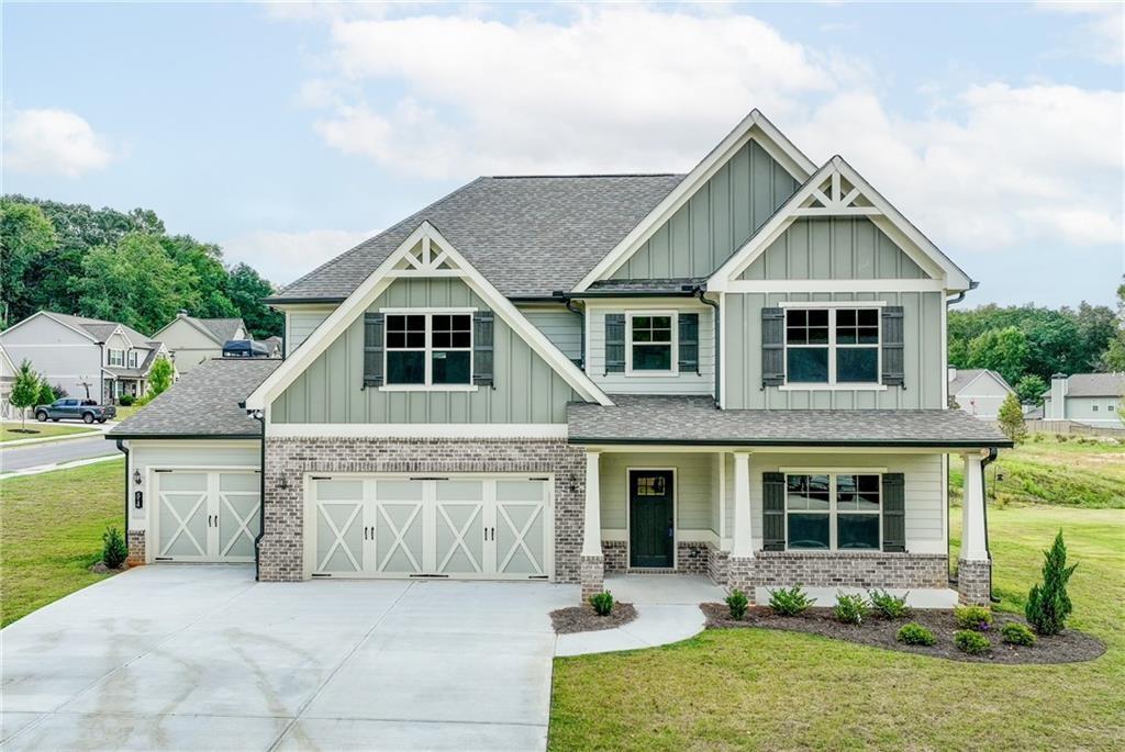 514 Adventure Trail Jefferson, GA 30549 - Photo 5 of 49 a front view of house with yard and green space