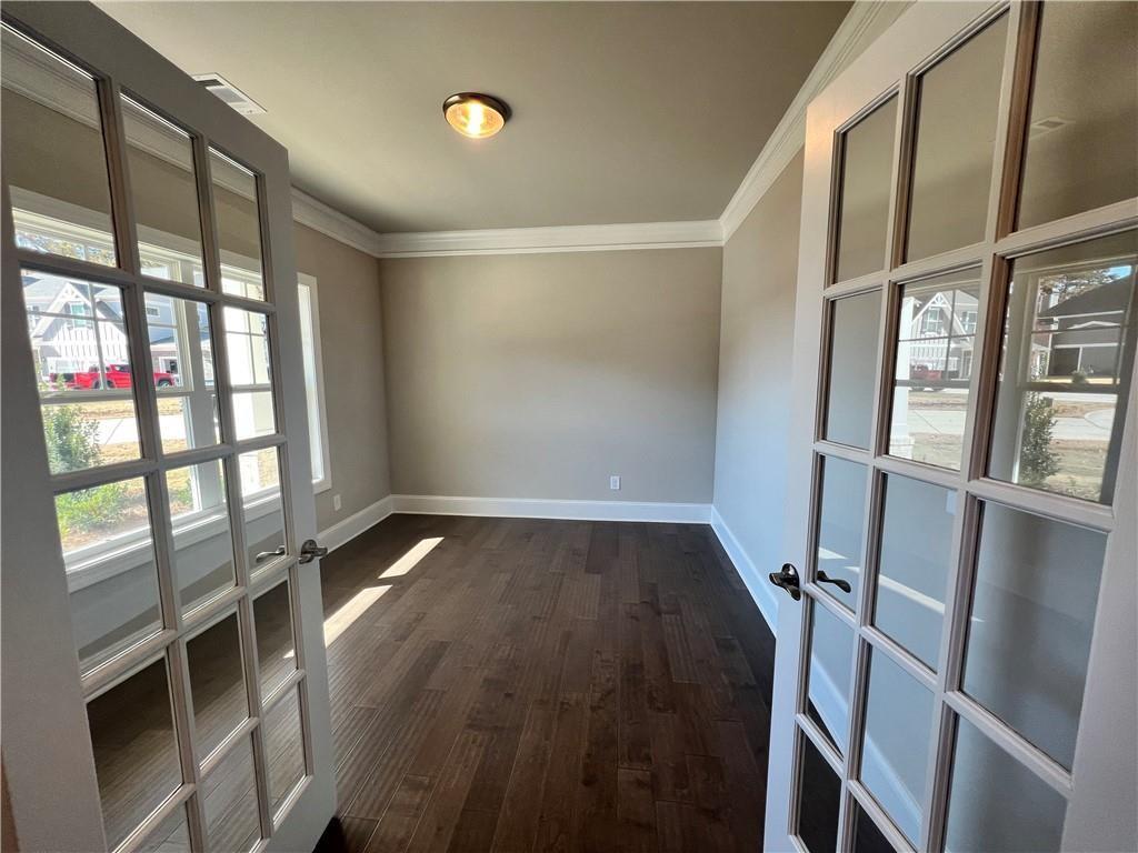 514 Adventure Trail Jefferson, GA 30549 - Photo 8 of 48 a view of entryway with wooden floor and door