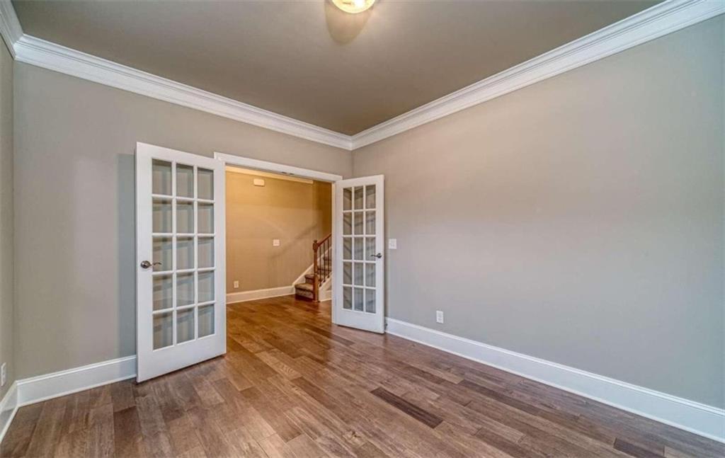 514 Adventure Trail Jefferson, GA 30549 - Photo 9 of 49 a view of empty room with wooden floor and fan