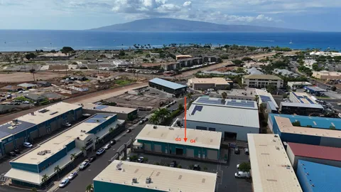an aerial view of a residential apartment building with a city view