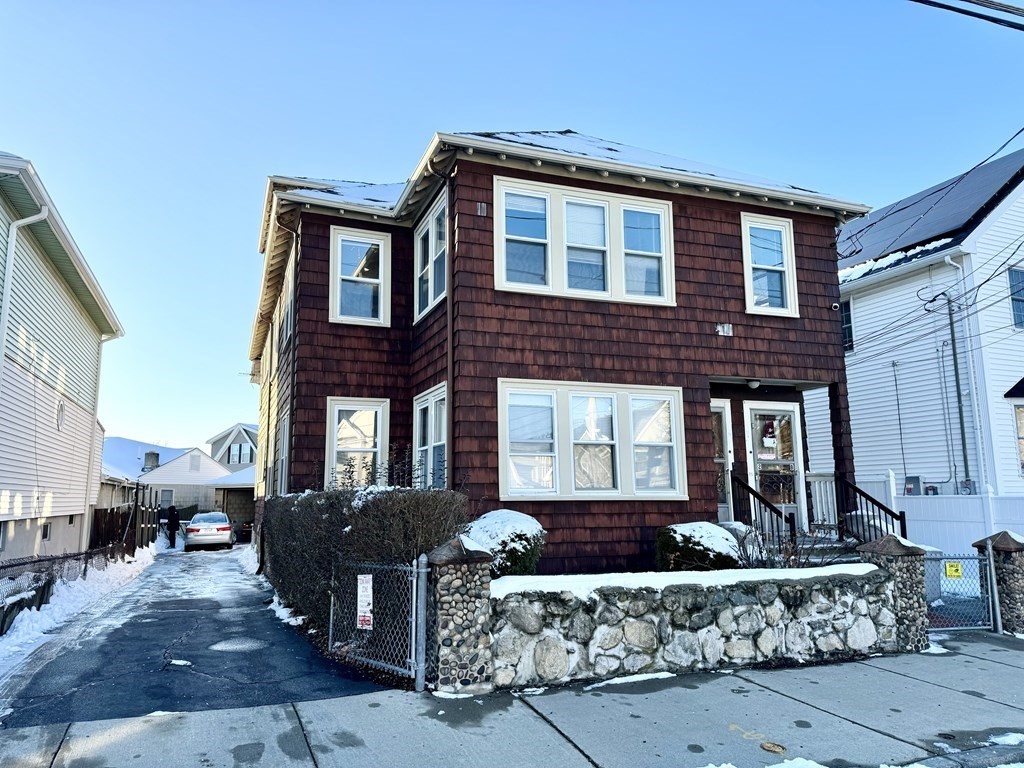 98 Shute Street Everett, MA 02149 - Photo 1 of 37 a front view of a house with a garden