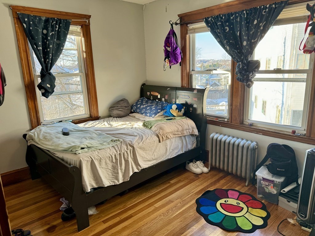 98 Shute Street Everett, MA 02149 - Photo 11 of 37 a bedroom with a bed and a window