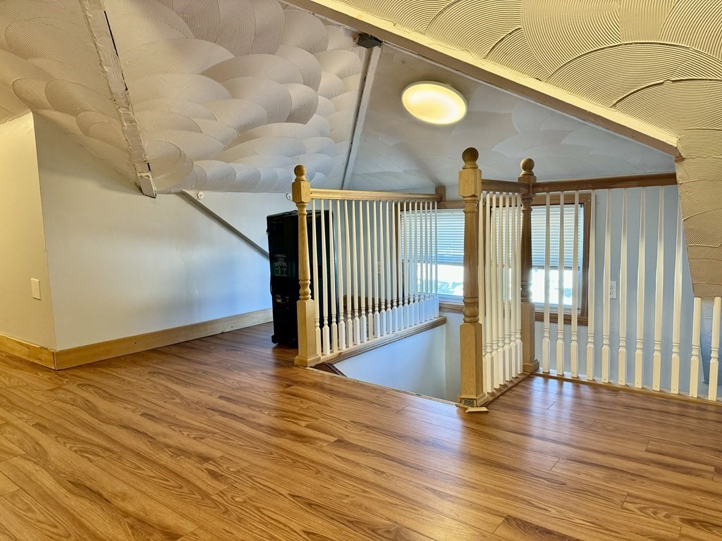 98 Shute Street Everett, MA 02149 - Photo 13 of 37 a view of a hallway with wooden floor