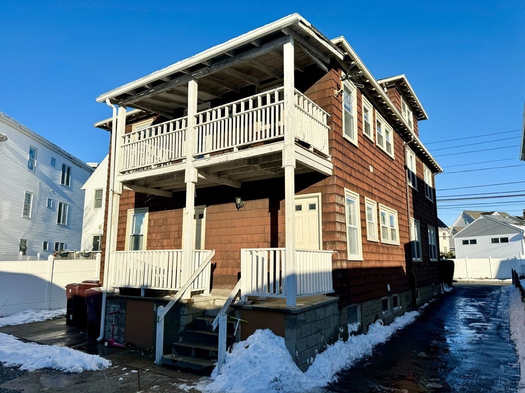 98 Shute Street Everett, MA 02149 - Photo 2 of 37 a front view of a house with a balcony