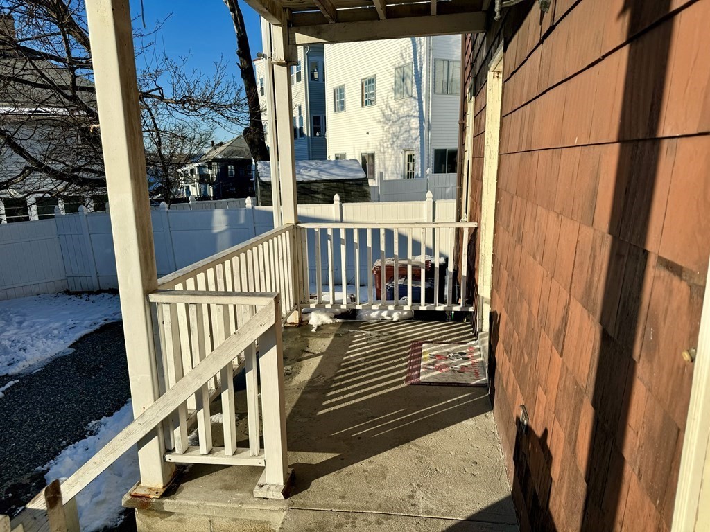 98 Shute Street Everett, MA 02149 - Photo 30 of 37 a view of a balcony with wooden floor and stairs