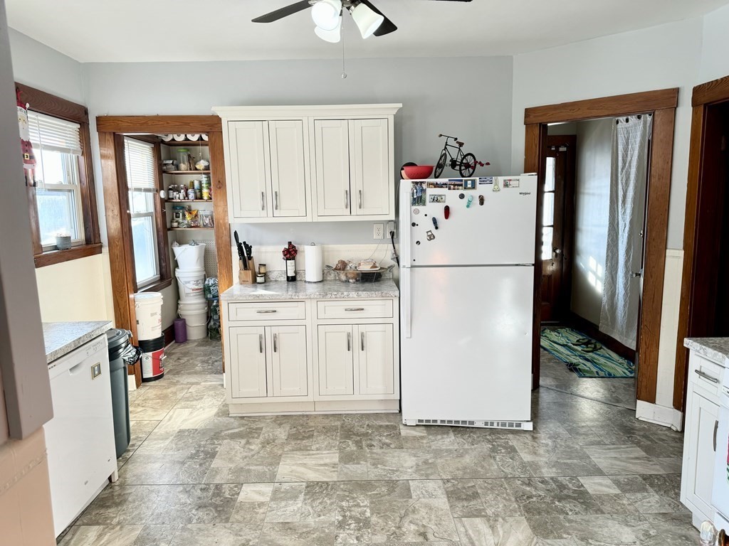 98 Shute Street Everett, MA 02149 - Photo 4 of 37 a white refrigerator freezer sitting in a kitchen