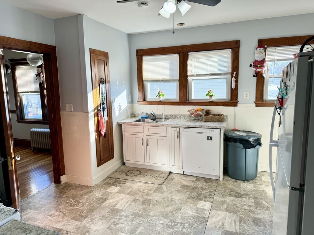 98 Shute Street Everett, MA 02149 - Photo 6 of 37 a kitchen with a stove and a refrigerator