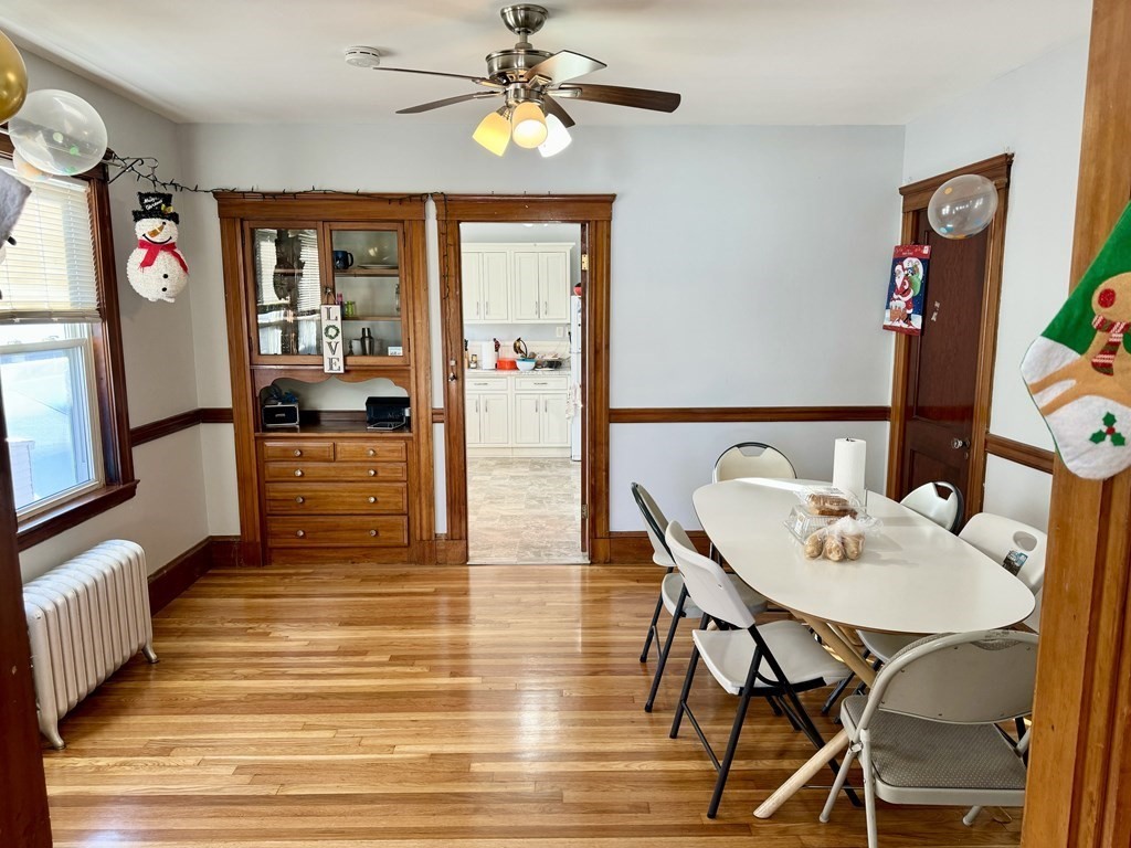 98 Shute Street Everett, MA 02149 - Photo 7 of 37 a view of a dining room with furniture kitchen and wooden floor