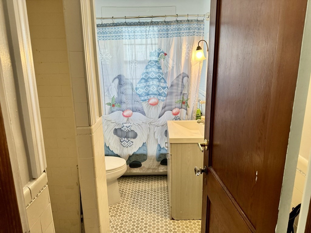 98 Shute Street Everett, MA 02149 - Photo 9 of 37 a bathroom with a window and shower