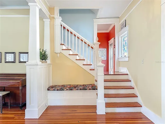 a view of a dining room with furniture window and wooden floor
