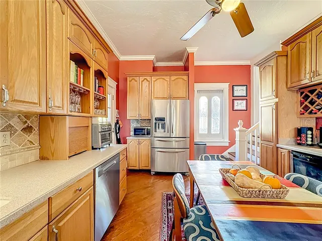 a bedroom with a large bed and a fireplace