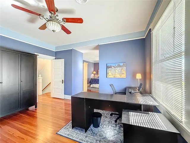 a view of balcony with wooden floor and fence