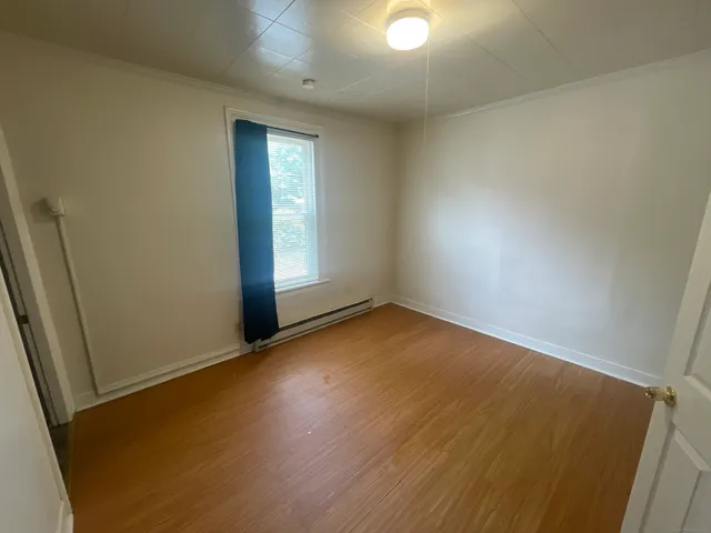 a view of staircase with wooden floor and stairs
