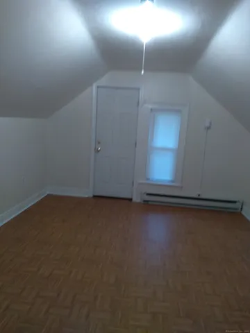 an empty room with a empty space and windows