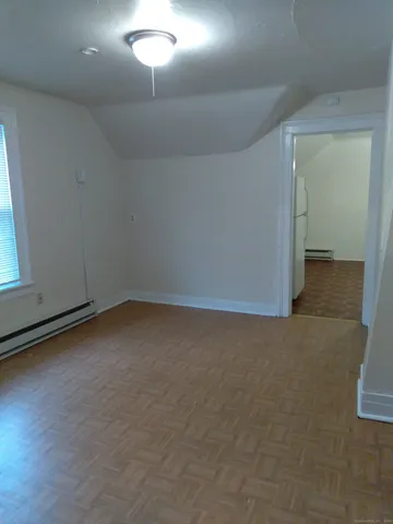 a view of an empty room and closet area