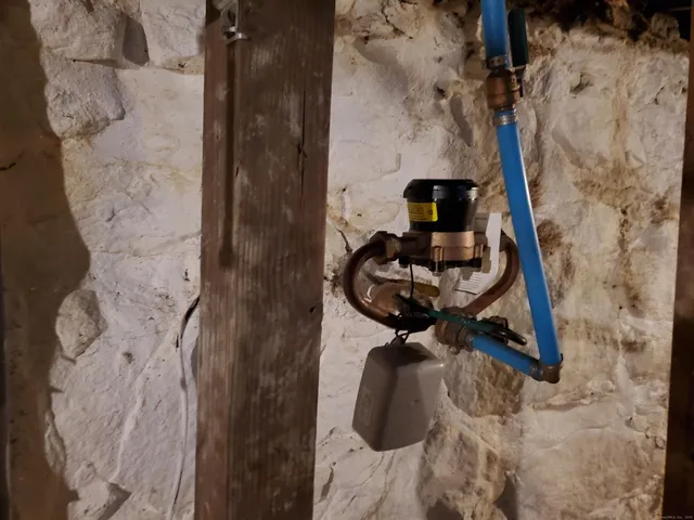 a roof deck with table and chairs