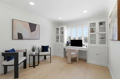 a bedroom with a bed and a painting