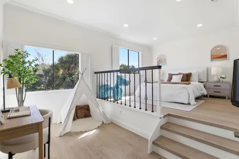 a bathroom with a double vanity sink toilet and shower