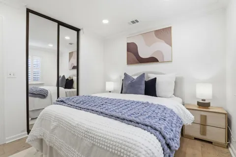 a view of a street with cars on the road