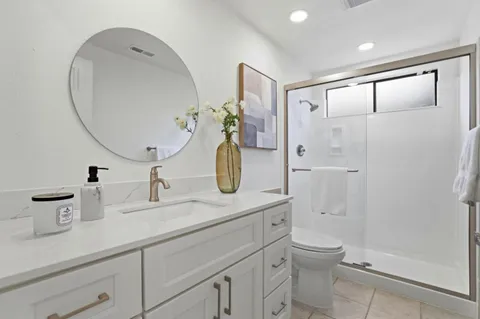 a view of a house with yard and sitting area