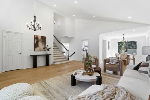 a kitchen with a refrigerator stove and sink