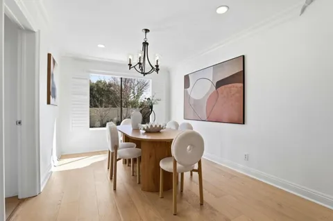 a kitchen with sink cabinets and stove top oven