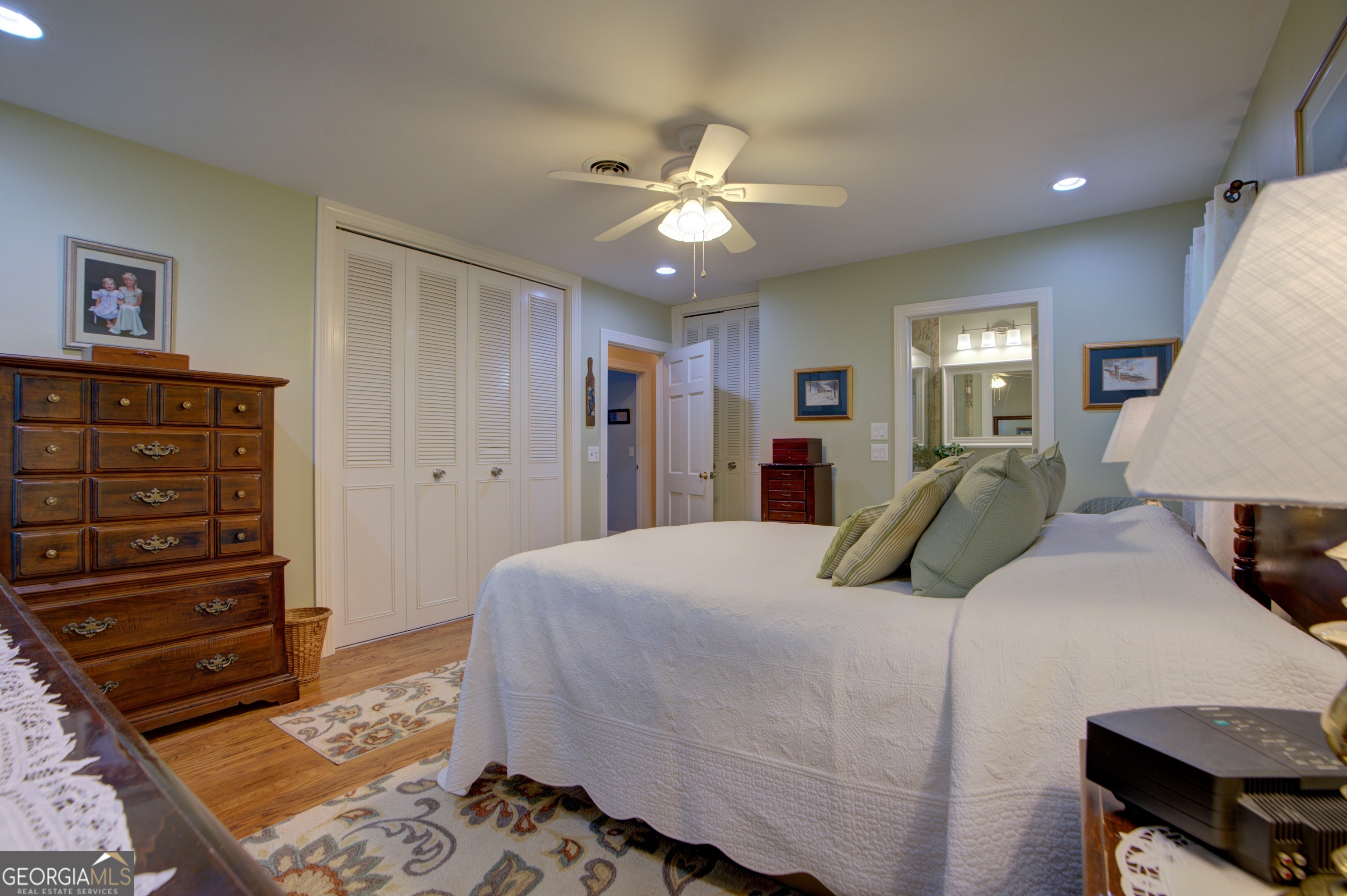 204 Green View Road Southwest Rome, GA 30165 - Photo 41 of 62 a bedroom with a bed and a chandelier