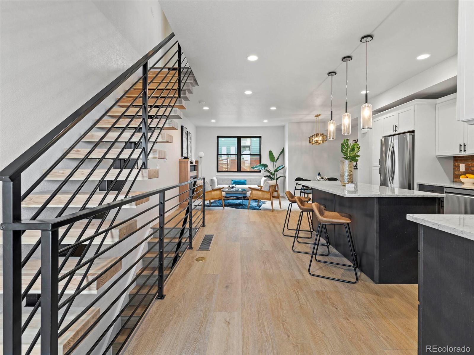 5423 South Prince Street, Unit B Littleton, CO 80120 - Photo 17 of 40 a view of a living room and dining room