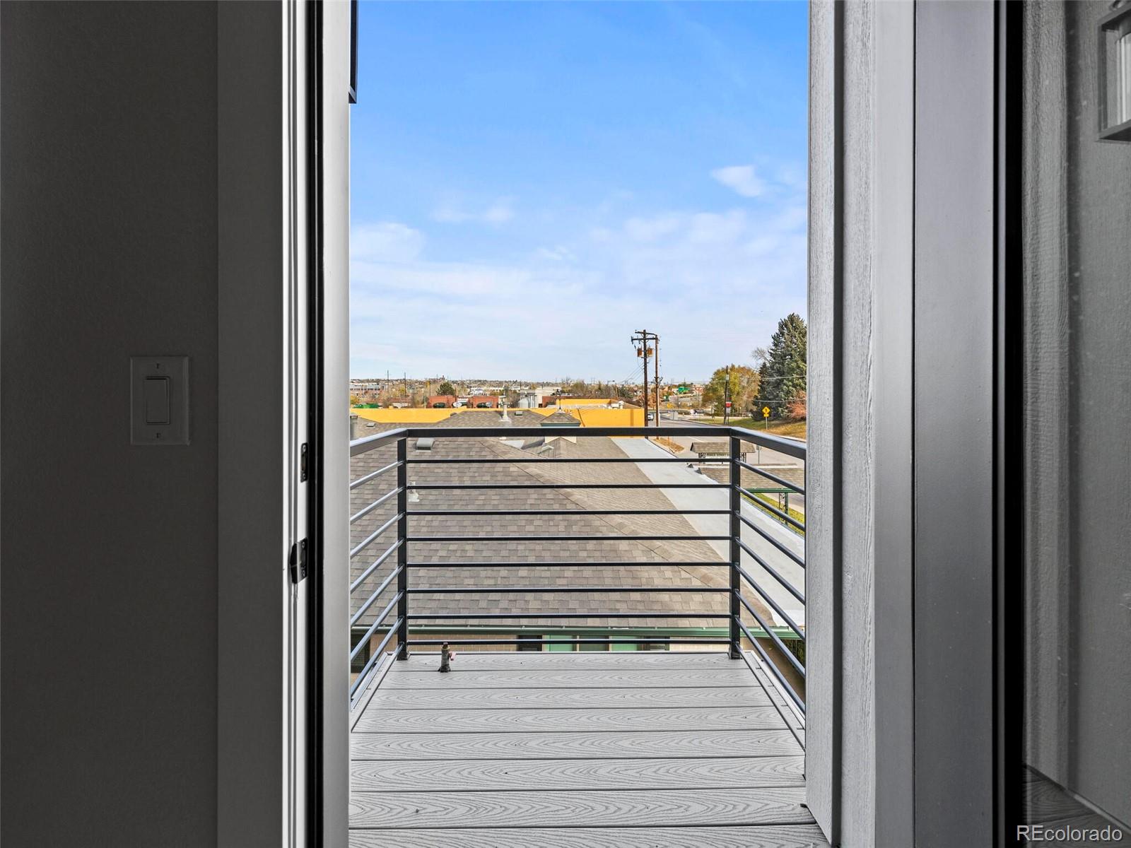 5423 South Prince Street, Unit B Littleton, CO 80120 - Photo 20 of 40 a view of a balcony with an outdoor space