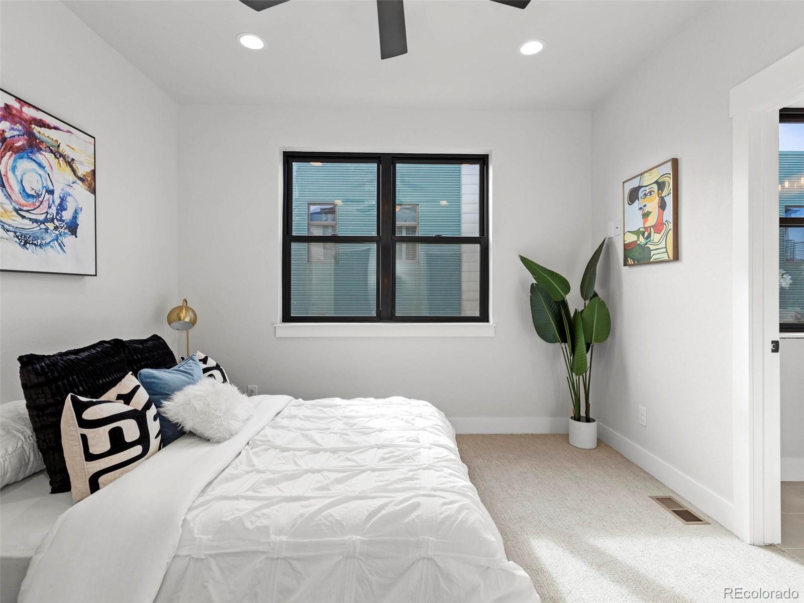 5423 South Prince Street, Unit B Littleton, CO 80120 - Photo 21 of 40 a bedroom with a bed and a window