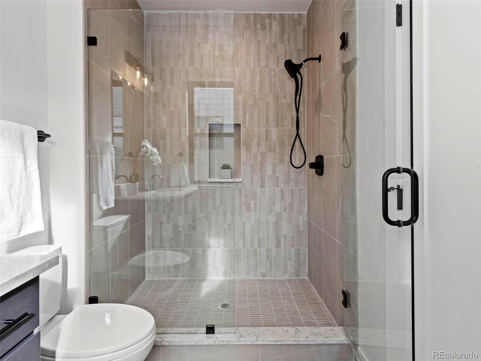 5423 South Prince Street, Unit B Littleton, CO 80120 - Photo 23 of 40 a bathroom with a shower