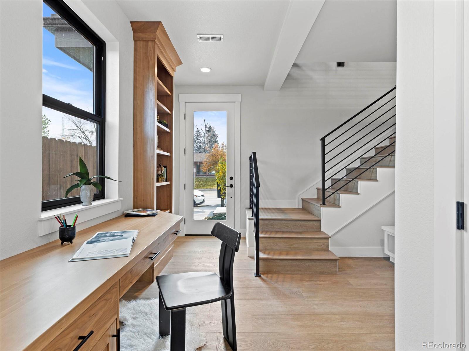 5423 South Prince Street, Unit B Littleton, CO 80120 - Photo 3 of 40 a view of a livingroom with furniture and staircase