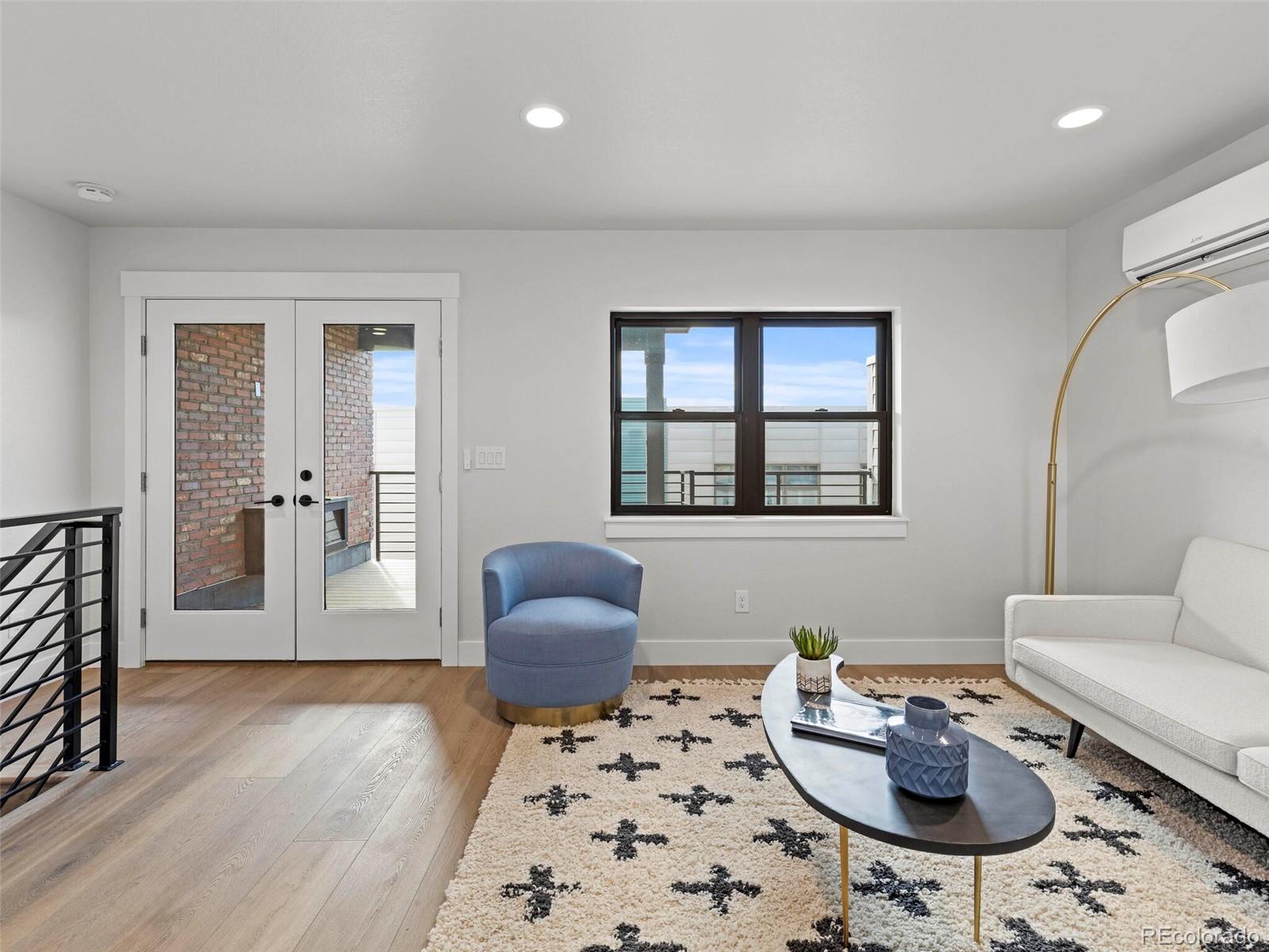 5423 South Prince Street, Unit B Littleton, CO 80120 - Photo 32 of 40 a living room with furniture a rug and a window