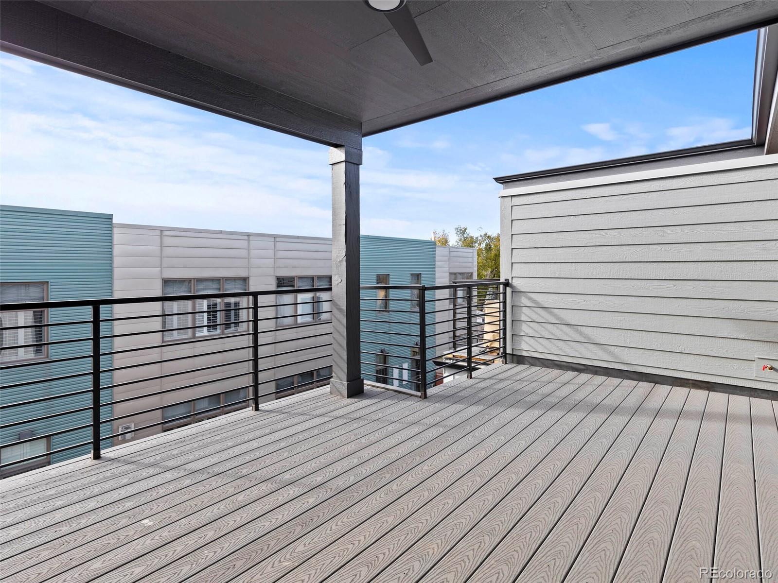 5423 South Prince Street, Unit B Littleton, CO 80120 - Photo 37 of 40 a view of balcony with floor to ceiling window with wooden floor