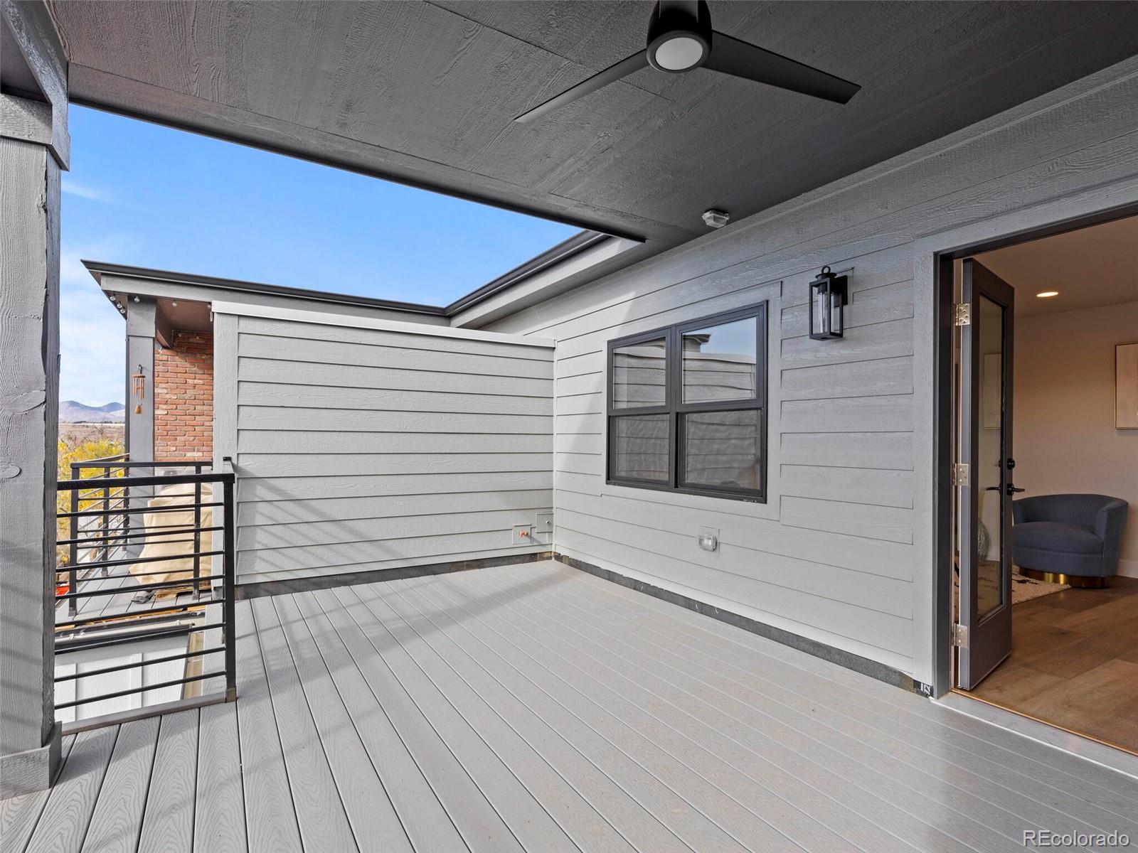 5423 South Prince Street, Unit B Littleton, CO 80120 - Photo 38 of 40 a view of a terrace with wooden floor and cabinet