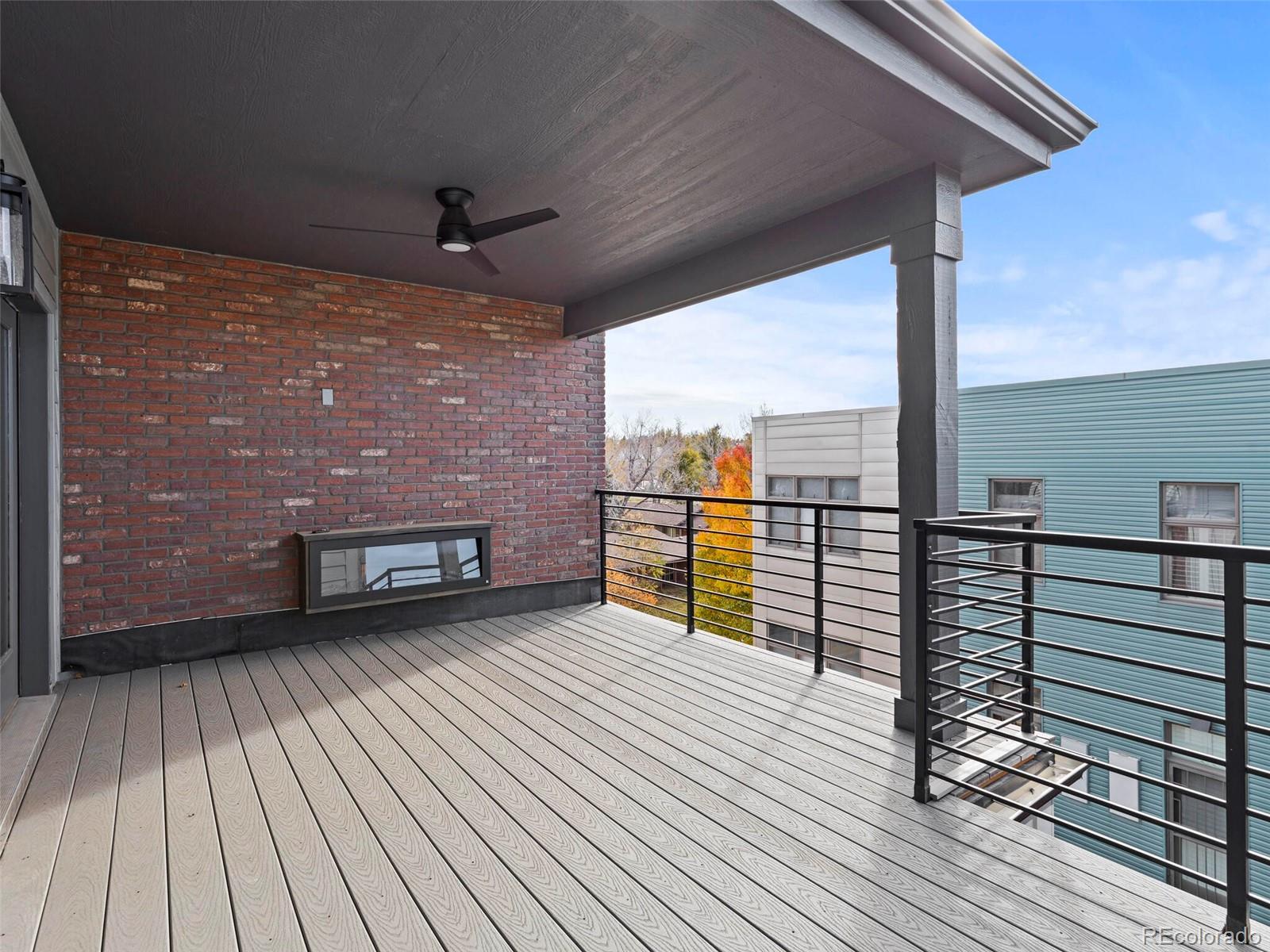 5423 South Prince Street, Unit B Littleton, CO 80120 - Photo 39 of 40 a view of a balcony with wooden floor