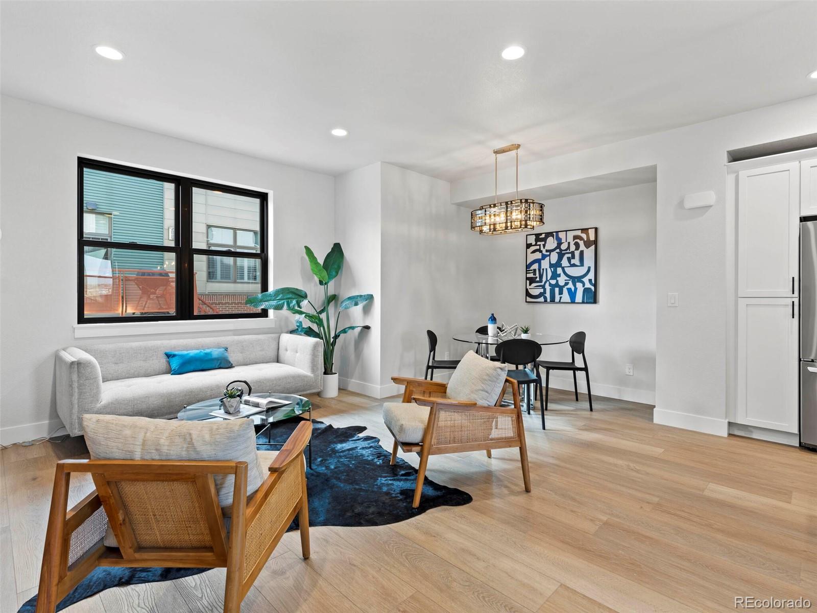 5423 South Prince Street, Unit B Littleton, CO 80120 - Photo 7 of 40 a living room with furniture and window