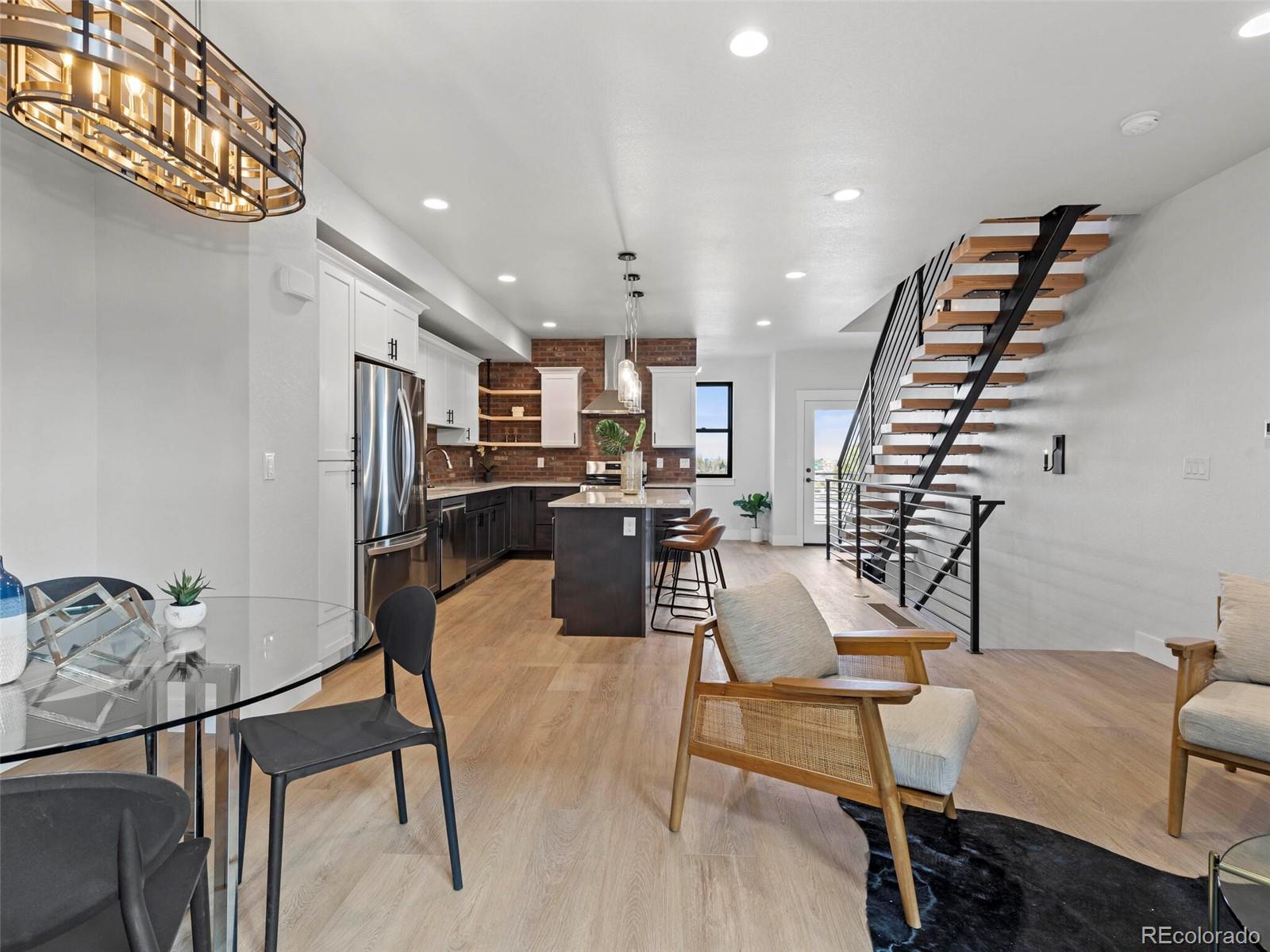 5423 South Prince Street, Unit B Littleton, CO 80120 - Photo 10 of 40 a view of a room with furniture and wooden floor