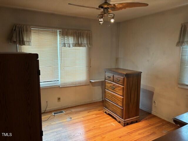 809 Simmons Street Durham, NC 27701 - Photo 11 of 16 a view of an empty room with a window and wooden floor