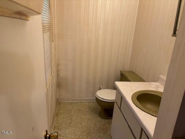 809 Simmons Street Durham, NC 27701 - Photo 12 of 16 a bathroom with a sink and a toilet